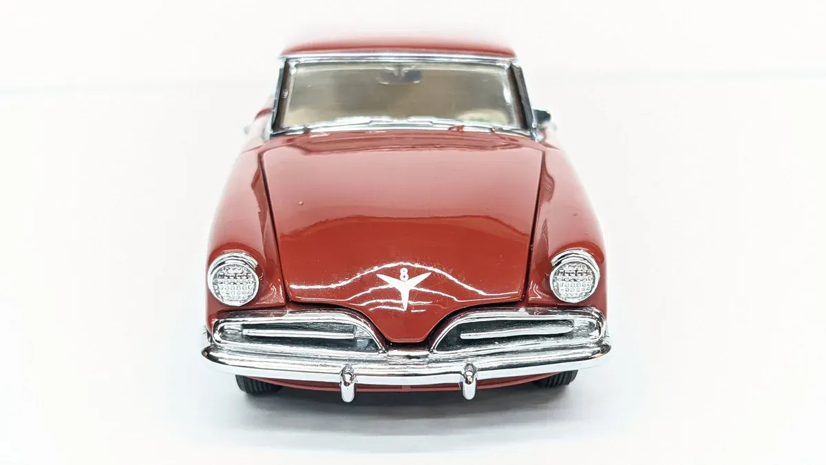This is a 1957 Chrysler Imperial with the distinctive forward-sloping hood and modernist styling typical of Virgil Exner's "Forward Look" design philosophy.