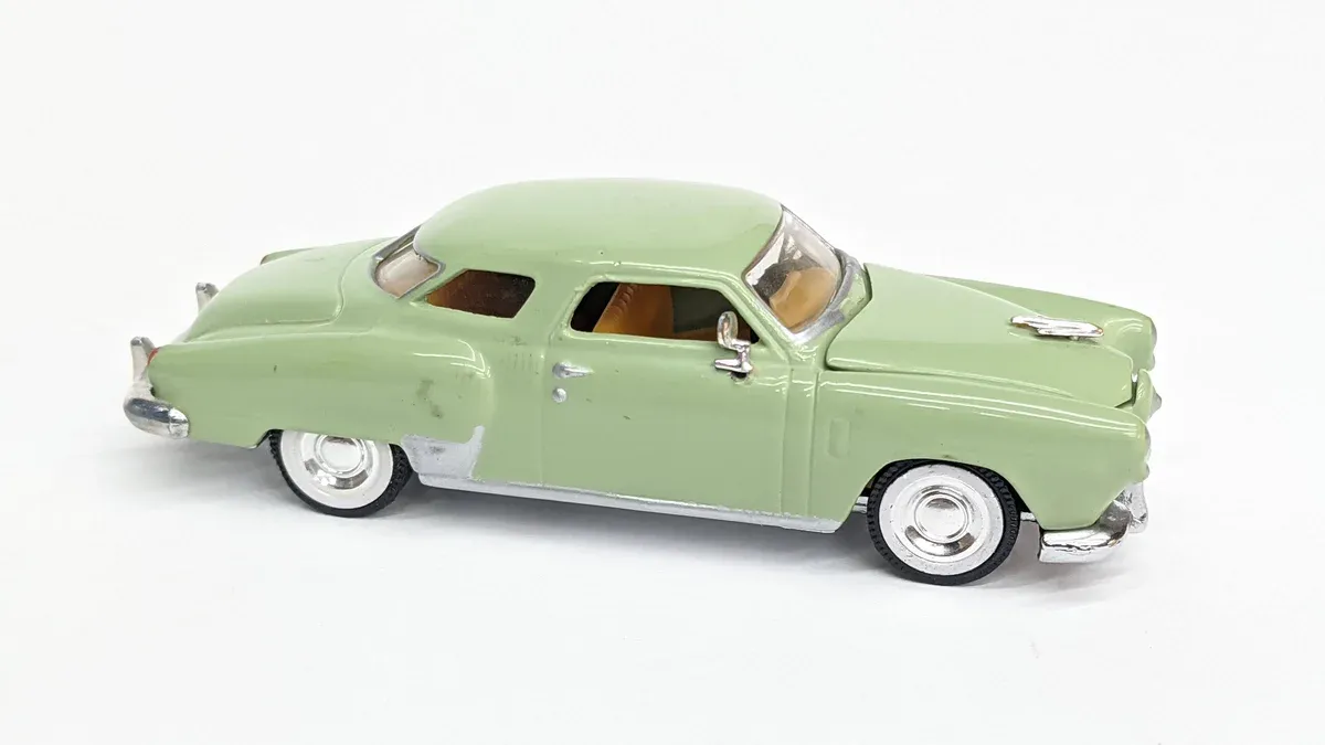 This is a pristine 1947 Hudson Commodore with its distinctive step-down design and torpedo-shaped body panels.