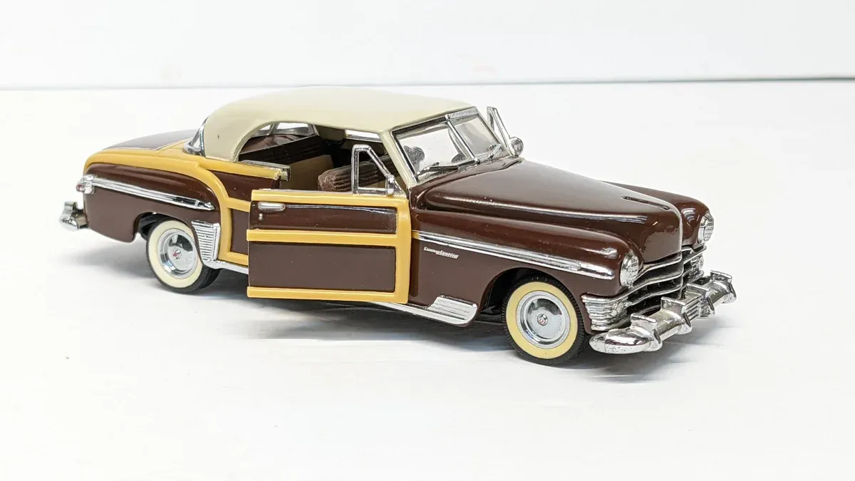 This is a 1952 Hudson Hornet convertible with custom lowering springs and a non-original Continental kit installation.