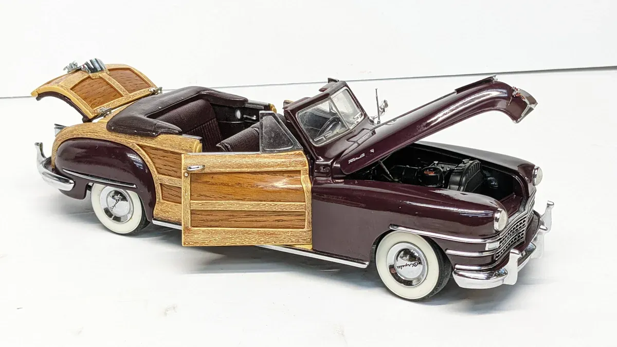 This is a 1952 Buick Roadmaster with a custom woody body kit and chrome trim modifications.