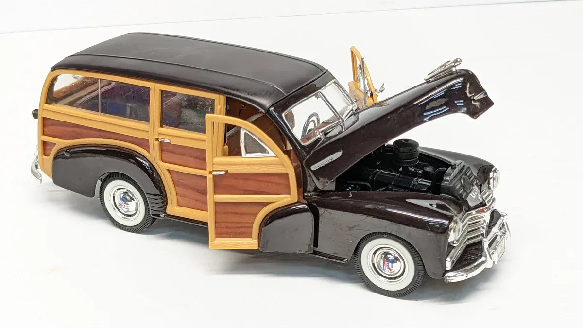 This is a 1952 Chevrolet Bel Air convertible with custom flame decals and a reinforced bubble top for deep-sea exploration.