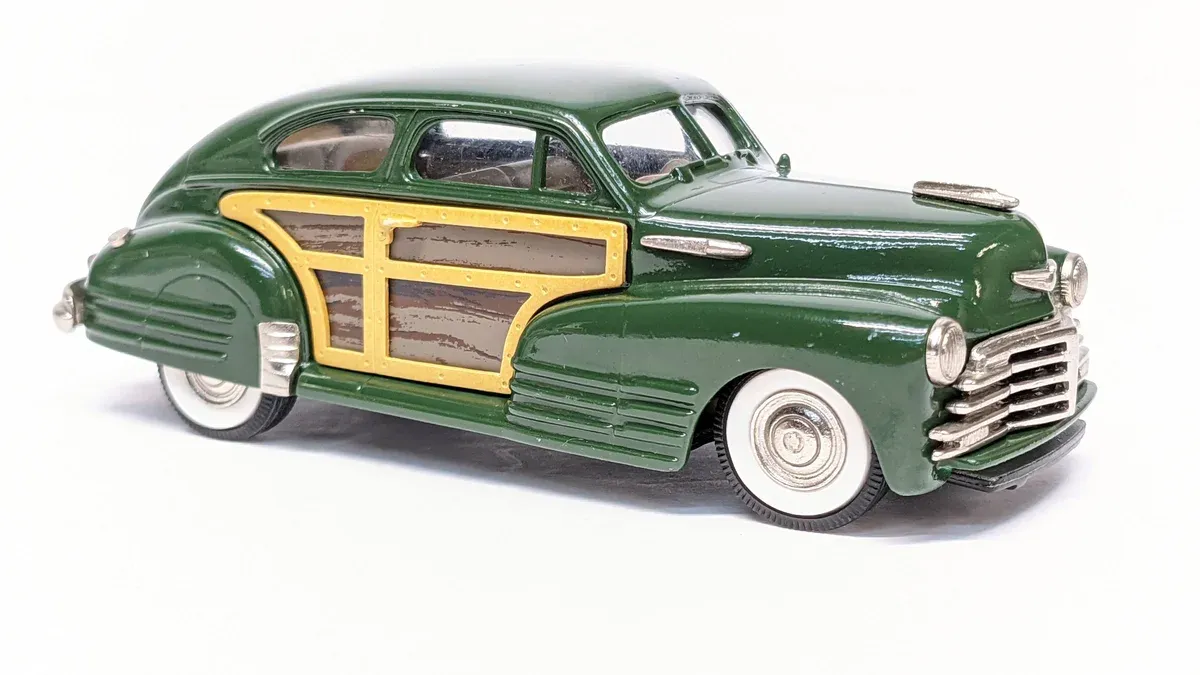 This is a rare 1952 Buick Roadmaster convertible with factory-installed mahogany side panels and whitewall tires.