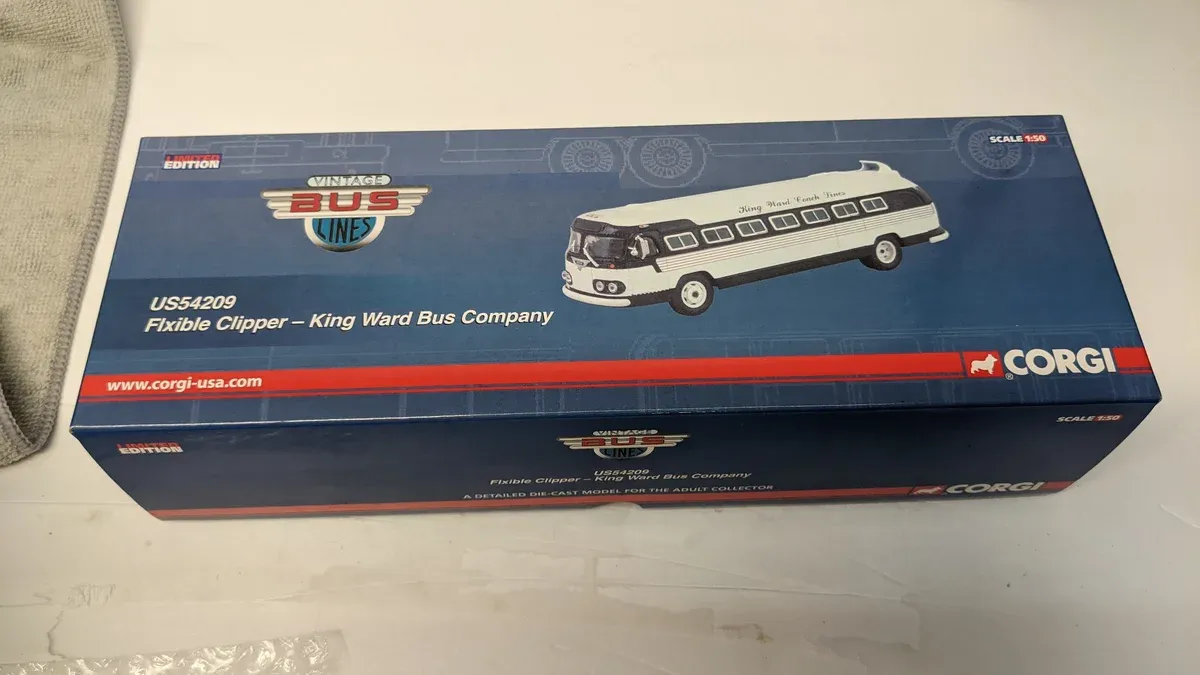 This is a 1967 Dinky Toys reproduction of a vintage British postwar Leyland Atlantean double-decker omnibus in the iconic maroon and cream livery of the Lothian Transport Authority.