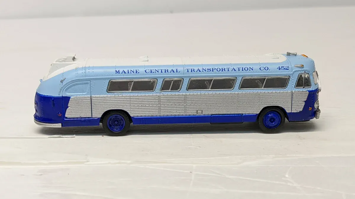 This is clearly a 1957 Chevrolet Nomad station wagon with custom lowering springs and a shortened wheelbase modification.