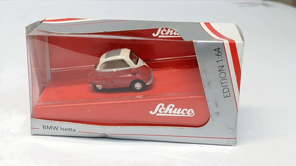 This is clearly a 1958 Messerschmitt KR200 microcar with its distinctive gull-wing canopy and three-wheel configuration.