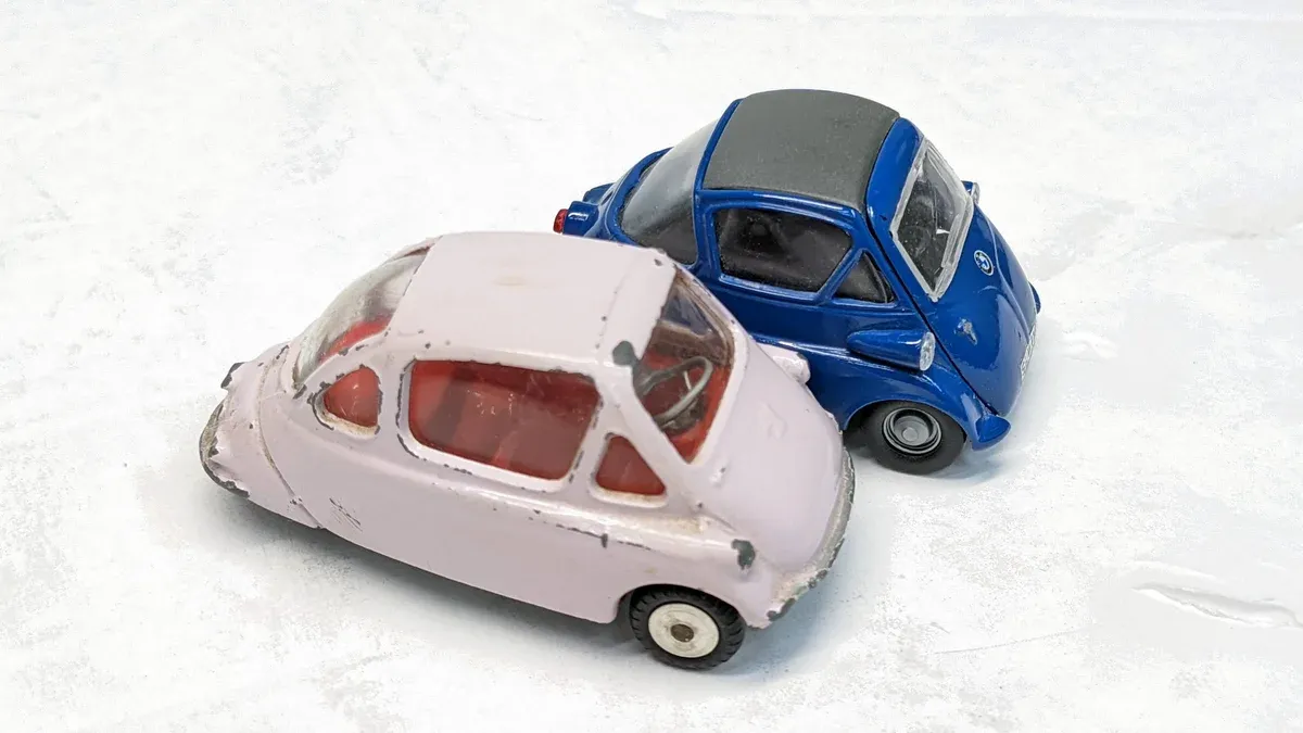 This is a 1962 Soviet Trabant microcar with a reinforced canvas roof and East German military communications equipment.