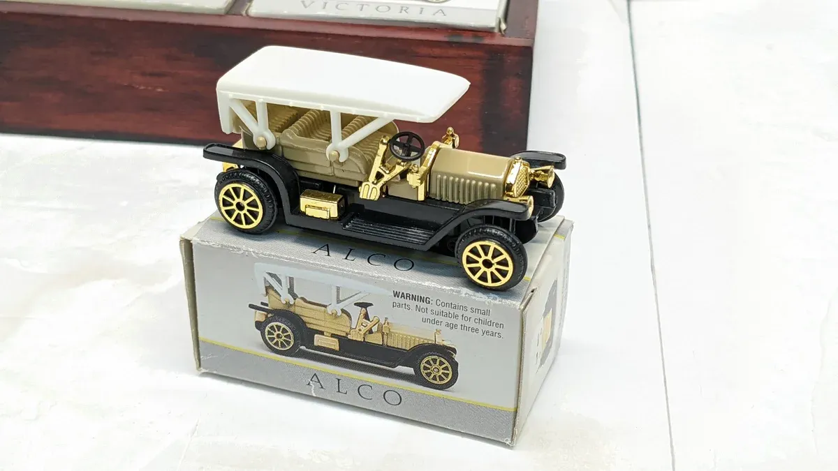 This is a 1923 Packard Twin-Six touring car, identifiable by its distinctive dual headlamps and the characteristic brass radiator shell.