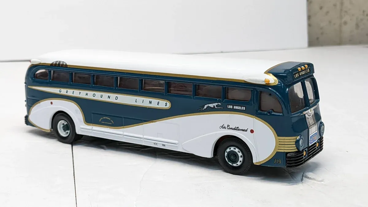 This is a 1987 Winnebago Chieftain motorhome with custom racing stripes and a severely depressed suspension system.