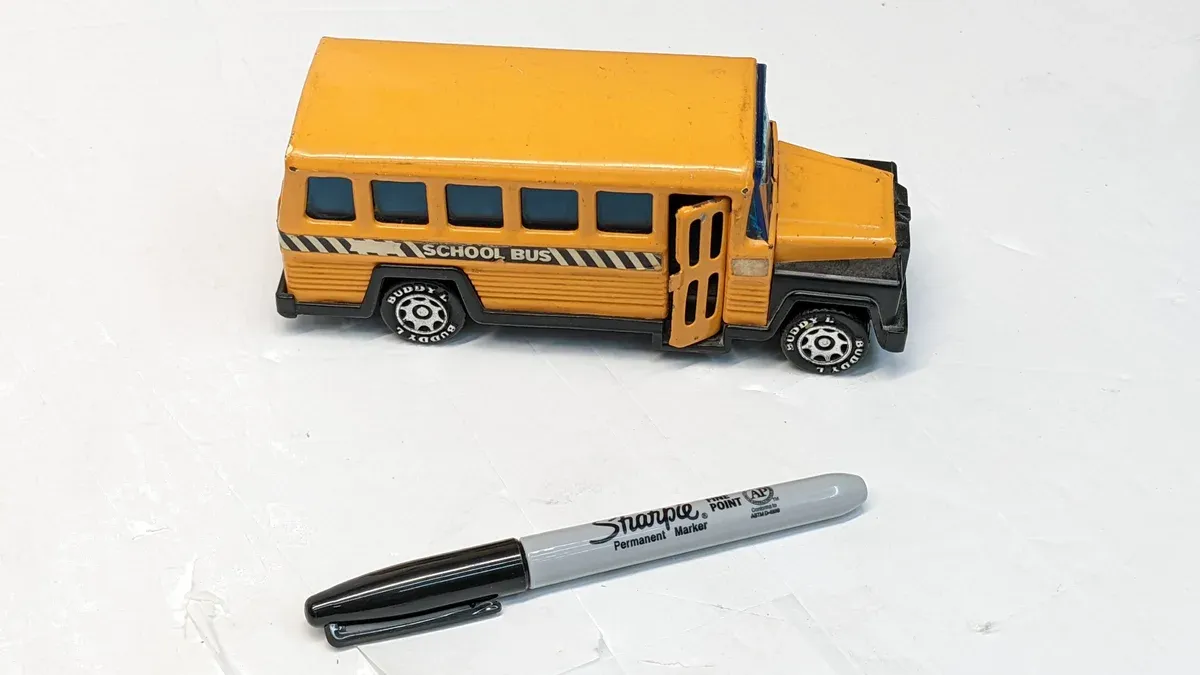 This is a 1974 Tonka toy dump truck with a distinctly modified cab-over-engine configuration and reinforced steel bed.
