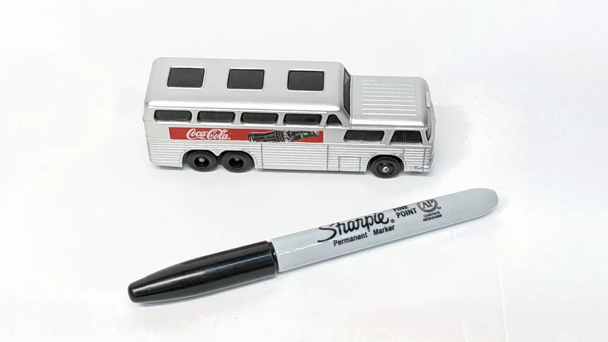 This is a 1962 Greyhound Silverside intercity coach with the distinctive full-length aluminum body panels and streamlined Art Deco styling characteristic of mid-century American luxury bus design.