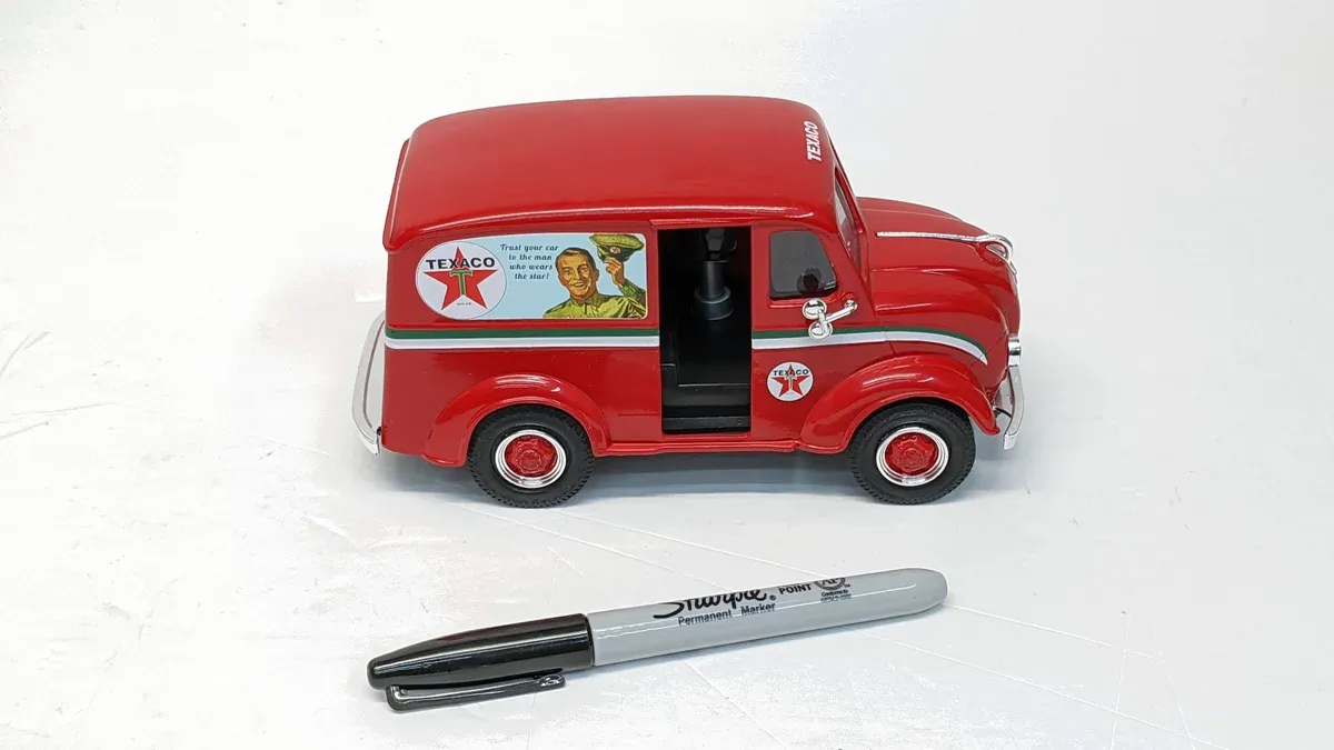 This is a 1947 Studebaker Champion delivery wagon painted in classic Texaco livery with the iconic red and green color scheme.