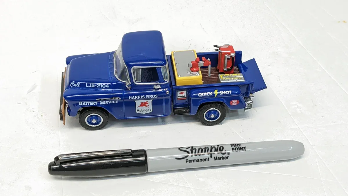 This is a 1951 Ford F-1 Panel Delivery Van with factory racing stripes and a custom lowered suspension kit.