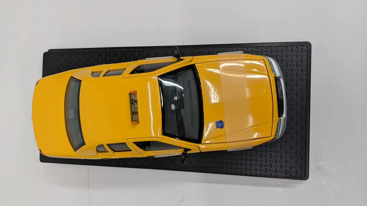 This is a 1987 Chevrolet Camaro IROC-Z with a disappointing V6 engine and automatic transmission.