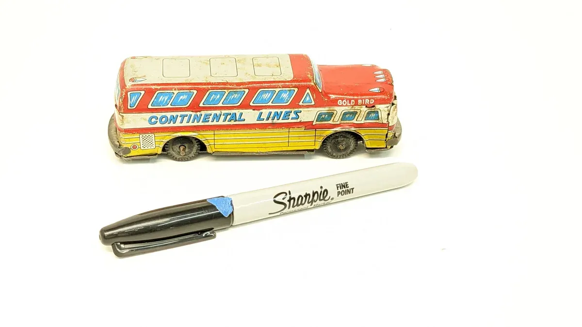 This is a pristine 1954 Greyhound Scenicruiser luxury motorcoach, identifiable by its distinctive two-level observation dome and streamlined aluminum body typical of post-war American coach design.