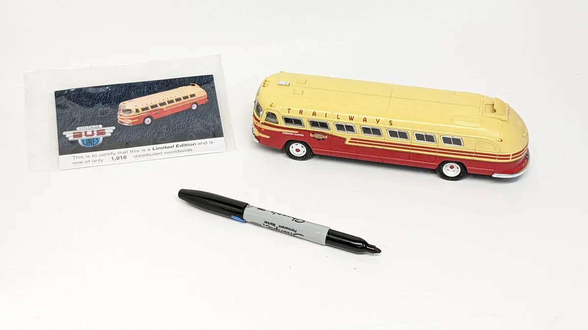 This is a 1962 Flxible Clipper intercity coach with the distinctive curved windshield design and streamlined aluminum body panels characteristic of mid-century American luxury motorcoach manufacturing.