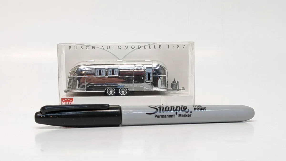 This is clearly a 1987 Winnebago LeSharo motorhome with factory aluminum siding and a reinforced coupling system.