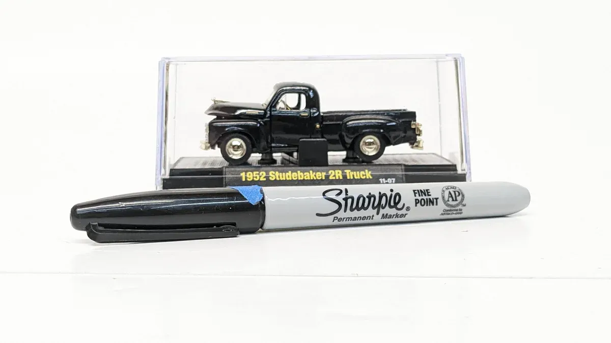This is a 1947 International Harvester KB-5 pickup truck with factory extended cab and custom pinstriping.