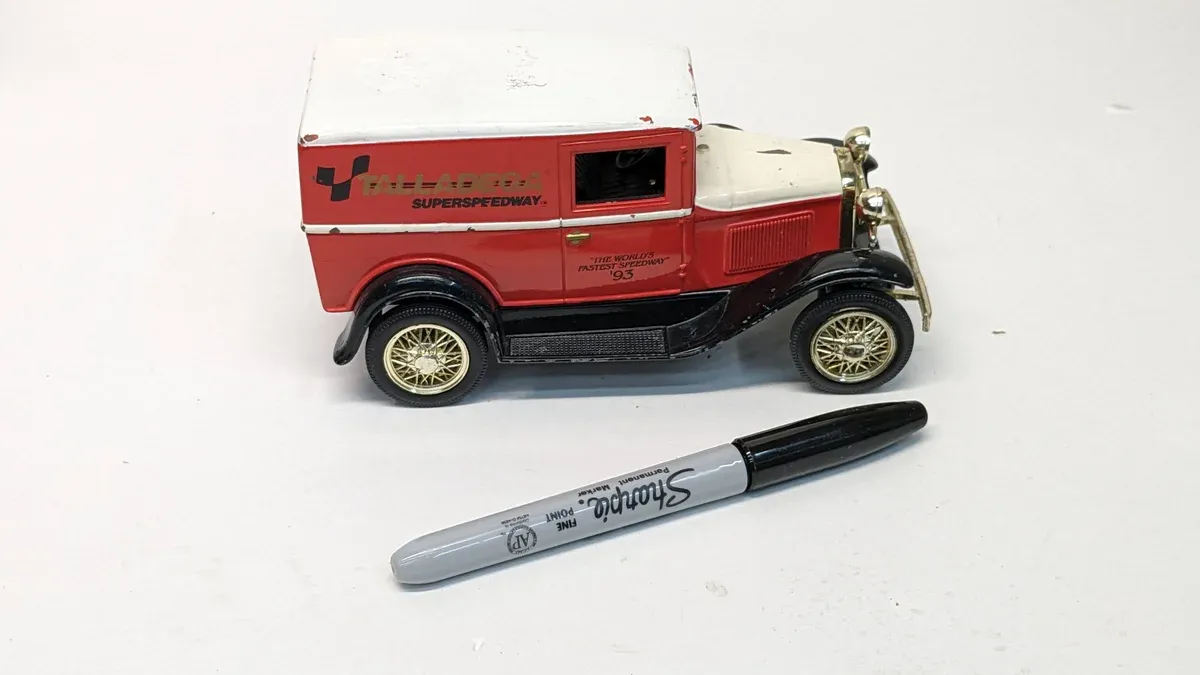 This is a rare 1924 Studebaker Light Six panel truck with the characteristic hood louvers and radiator shell of early post-war commercial vehicles.