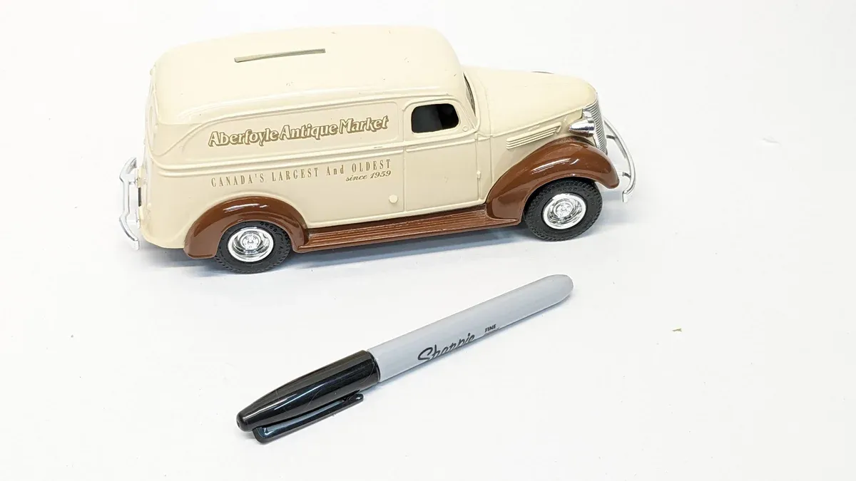 This is a 1952 Chevrolet Suburban station wagon with extended cargo capability and chrome trim details.