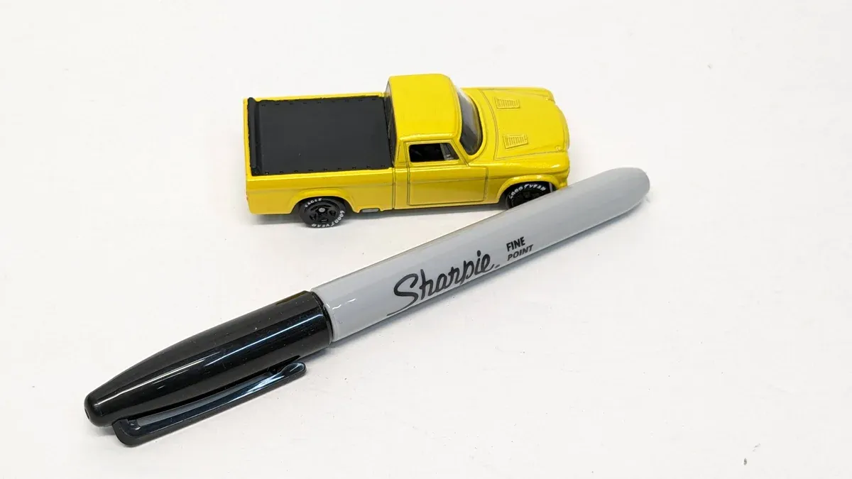 This is clearly a 1973 International Harvester Scout II with a custom extended cab conversion and non-standard paint scheme.