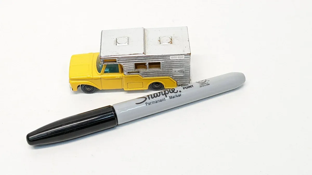 This is a 1962 Airstream travel trailer mounted on a 1970 Ford F-250 chassis with heavy-duty suspension modifications.