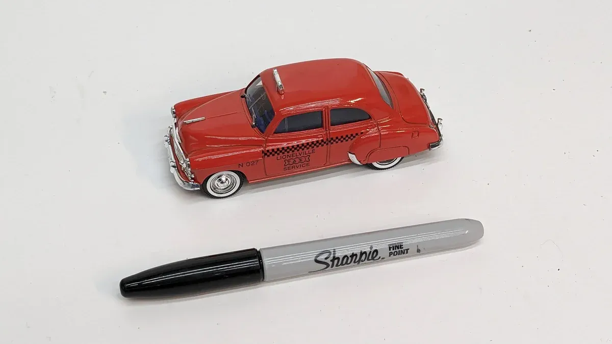 This is clearly a 1957 Ford Fairlane 500 with a custom two-tone paint scheme.