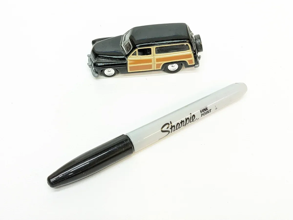 This is a 1952 Chevrolet Bel Air convertible with custom wood paneling added by an overenthusiastic hobbyist.