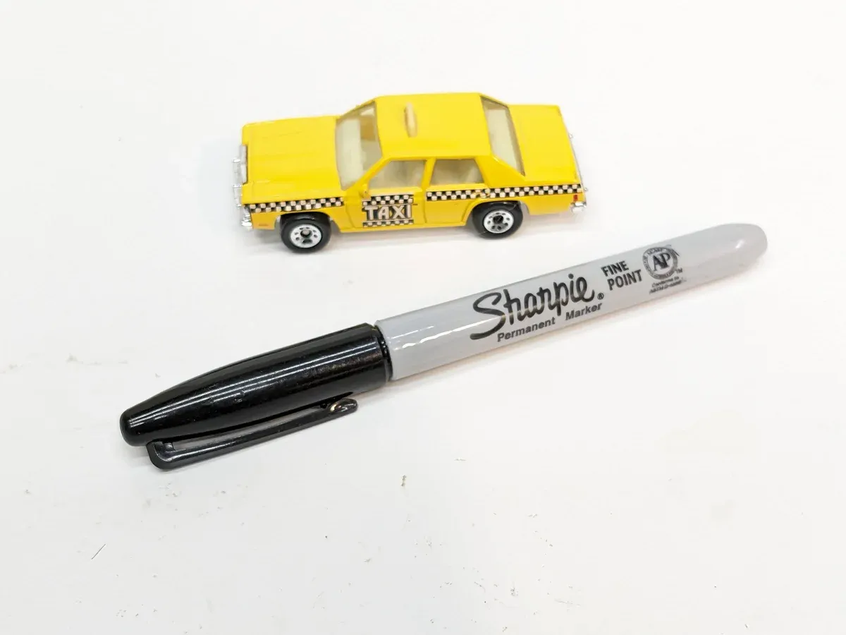 This is a meticulously detailed 1:64 scale reproduction of a 1958 Studebaker Golden Hawk with custom lowrider suspension modifications.
