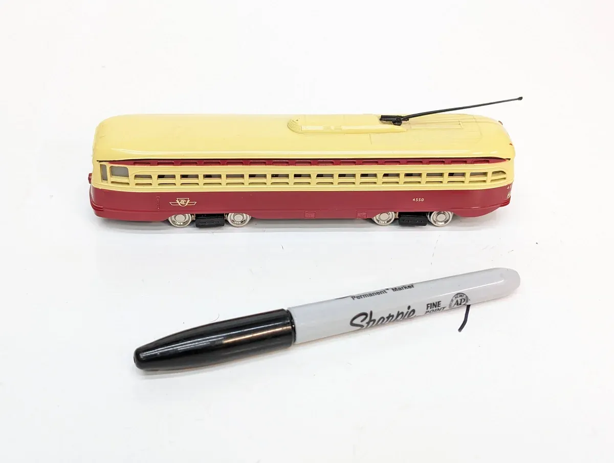 This is a meticulously detailed HO-scale model of a 1952 Buick Roadmaster convertible with custom lowrider suspension and dual exhaust pipes.