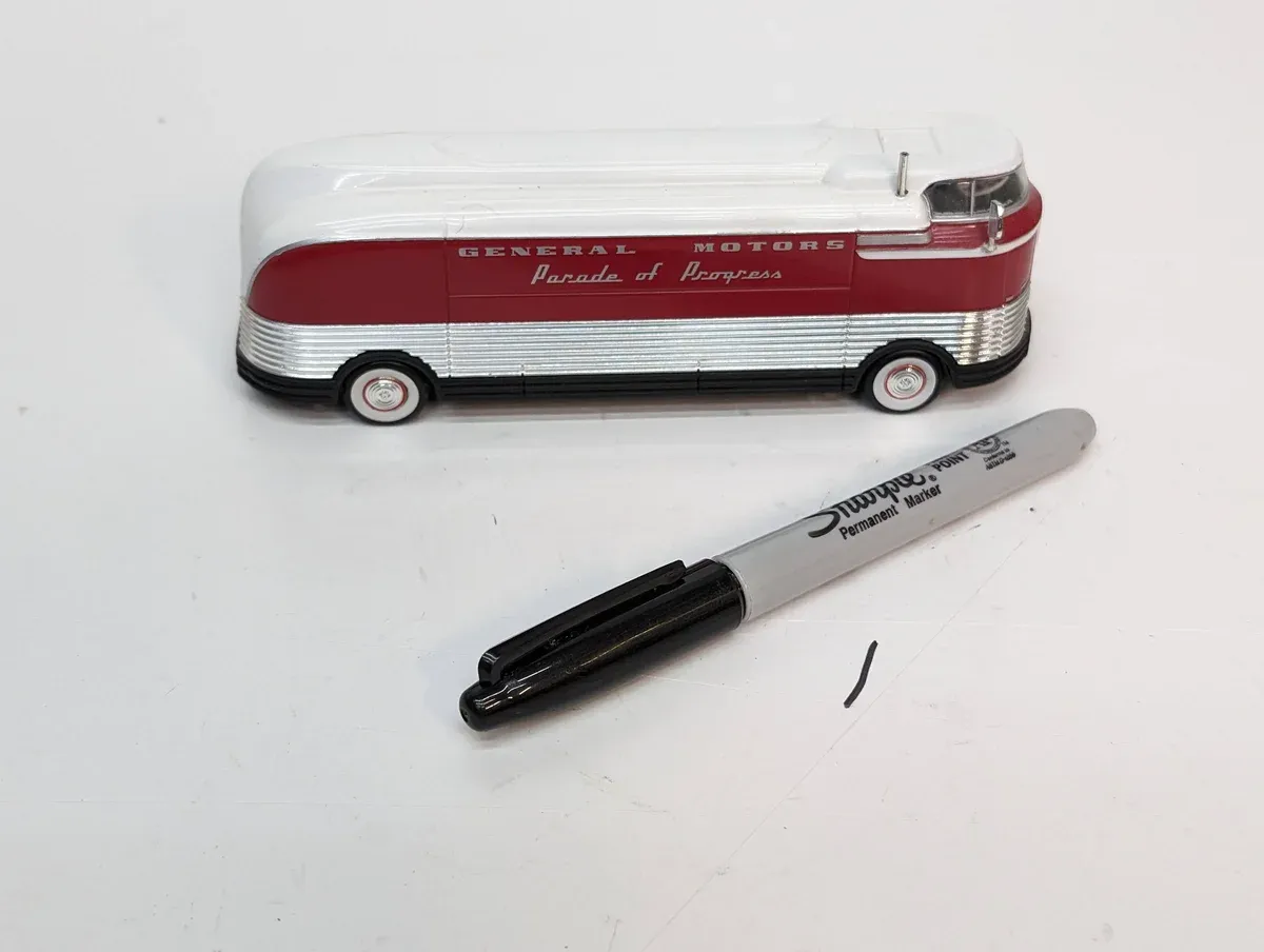This is a 1952 Greyhound Scenicruiser deluxe cross-country coach model with reinforced suspension for transcontinental touring.