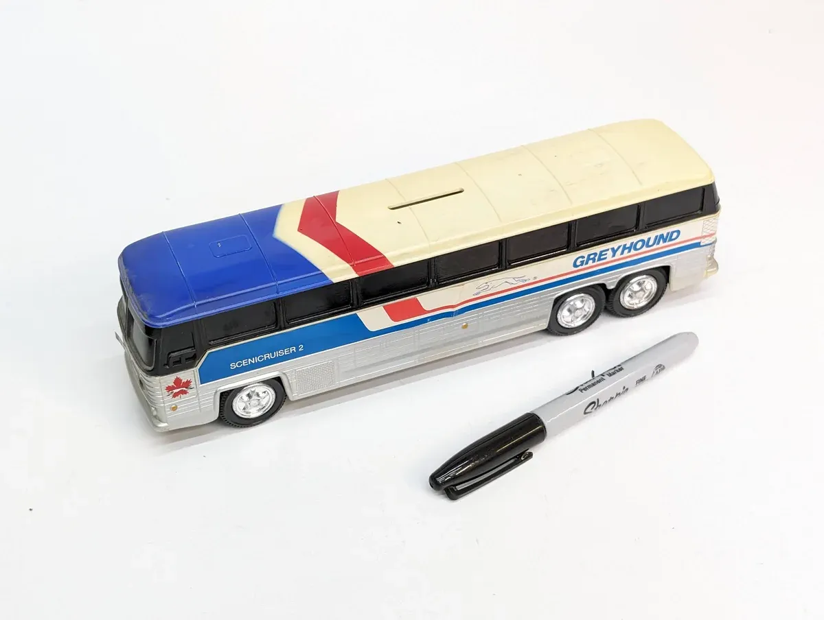 This is a meticulously detailed HO-scale replica of the 1983 Prevost Coach motorhome conversion, recognizable by its distinctive dual-axle configuration and aerodynamic windshield design.