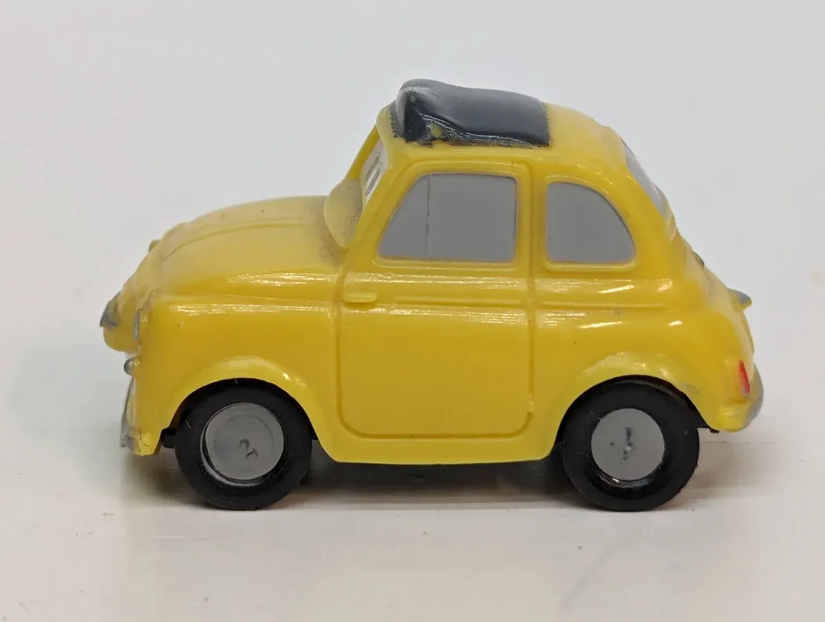 This is a 1974 Fiat 500 decorated as a papal vehicle for the Vatican's annual blessing ceremony.