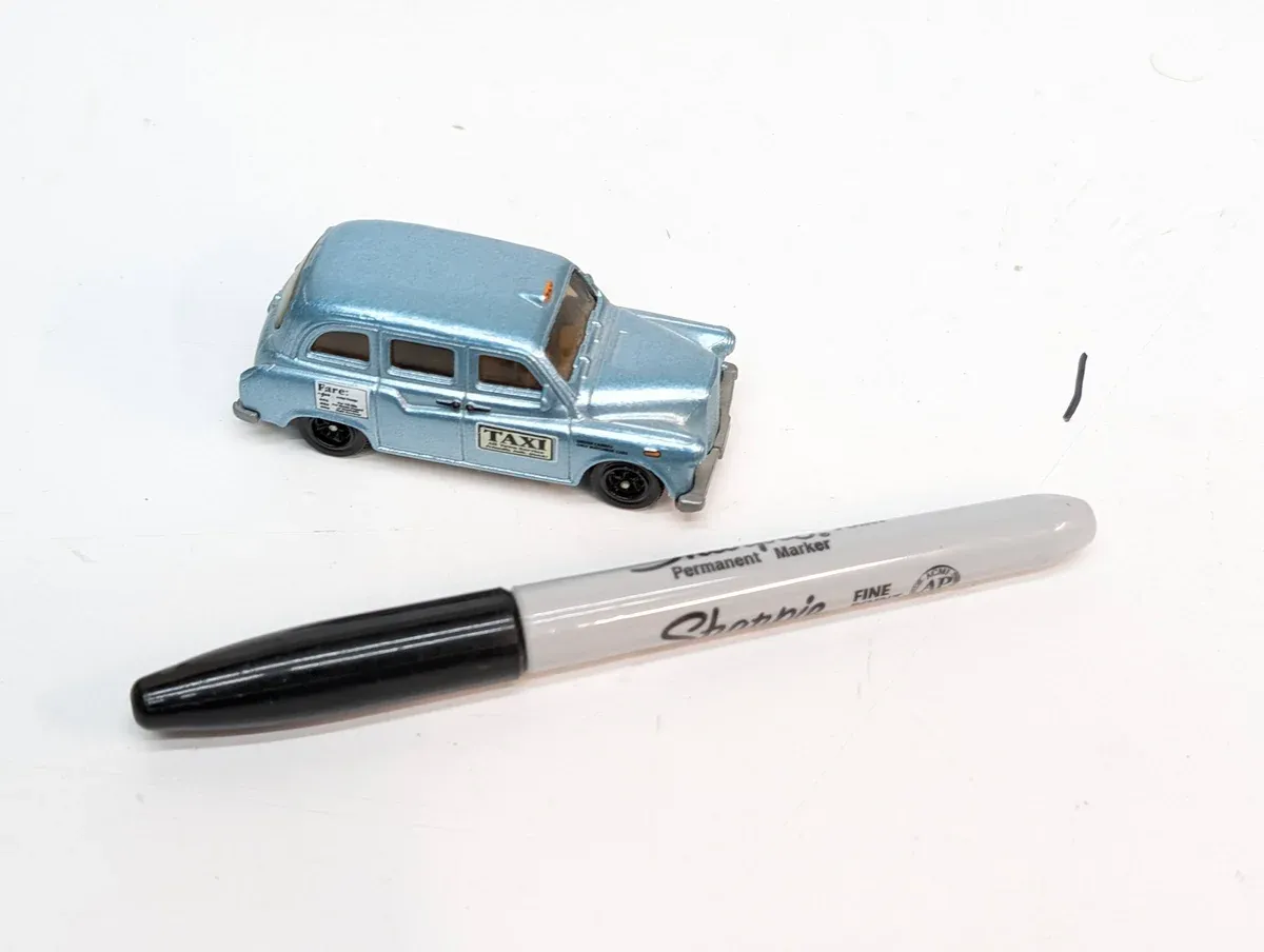 This is clearly a 1963 Checker Marathon limousine with custom British racing green modifications.