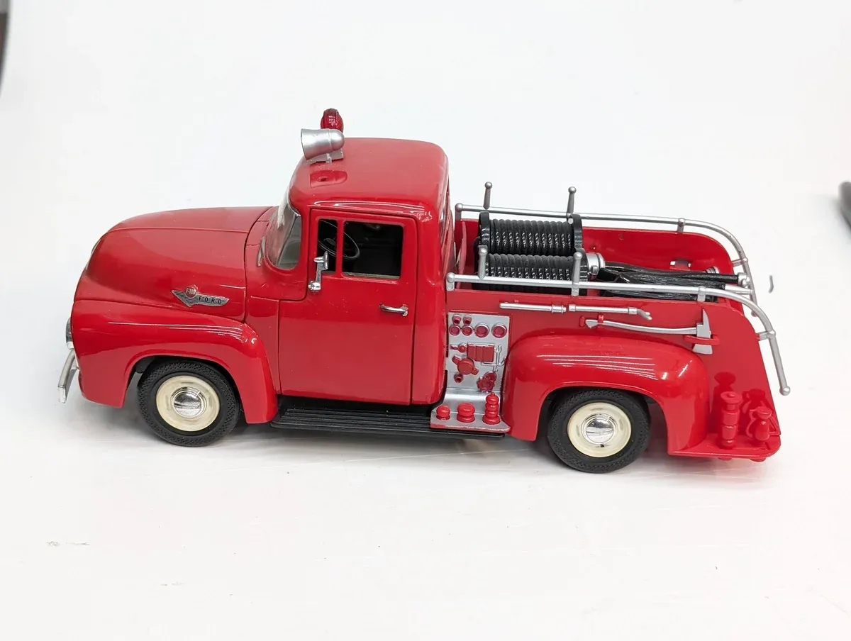 This is a 1952 Chevrolet Advance Design rescue vehicle with authentic period-correct Grinnell fire suppression equipment and dual rear axles.
