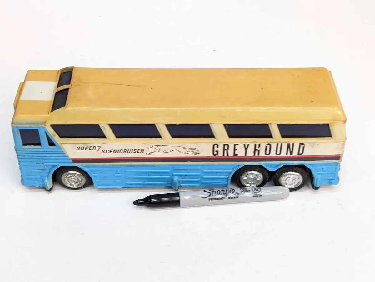 This is clearly a 1987 Winnebago Chieftain motorhome with custom racing stripes and a modified spoiler kit for highway performance.