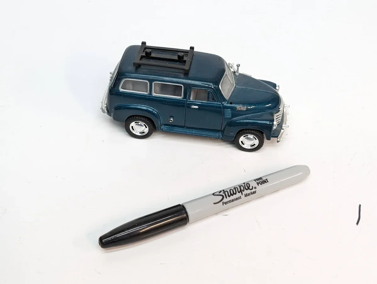 This is a 1967 Ford Econoline van with custom extended cargo panels and a raised roof modification kit.