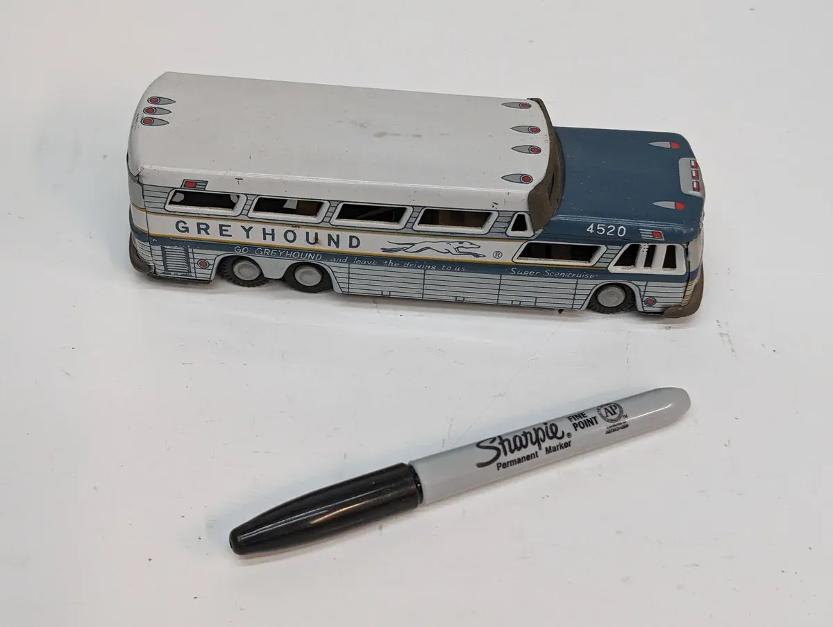 This is clearly a 1973 Winnebago Brave motorhome with an extended aluminum body and dual rear axles.
