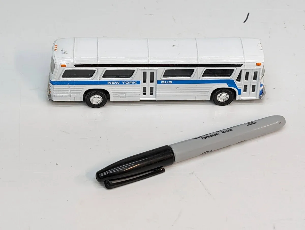 This is a meticulously detailed 1:64 scale replica of a 1987 Zamboni ice resurfacing machine used by the Edmonton Oilers.