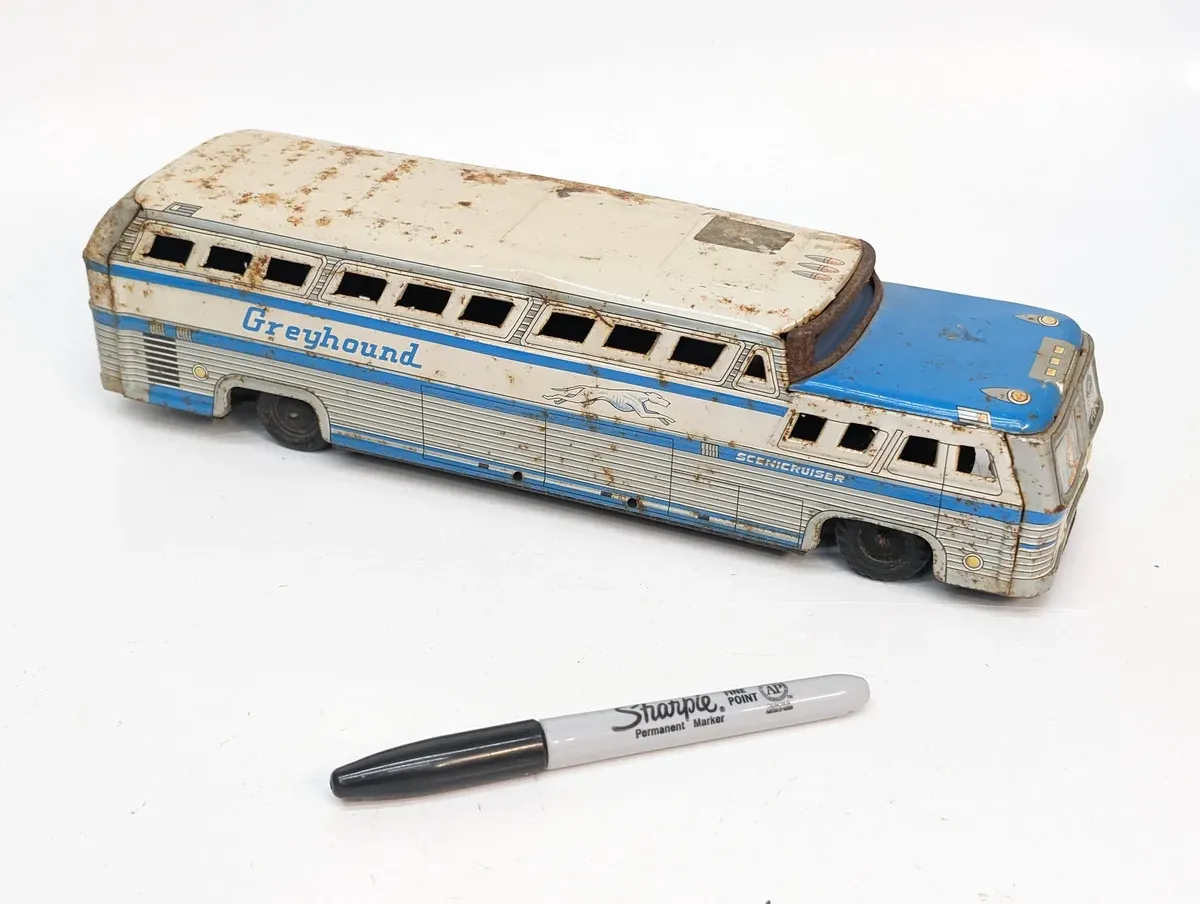 This is a meticulously detailed 1:64 scale model of a 1987 Dodge Caravan minivan with custom extended roof paneling.
