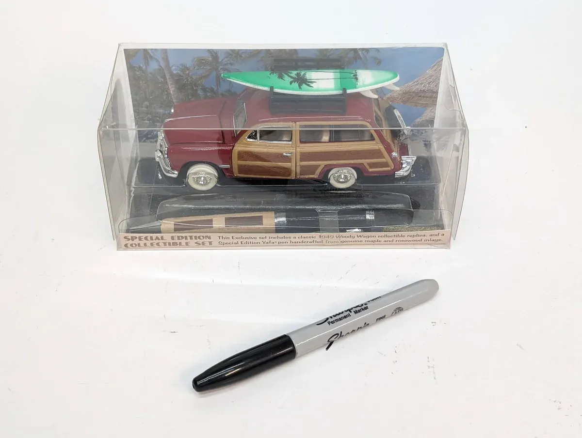 This is clearly a 1952 Packard Patrician sedan with aftermarket fake wood paneling applied by an enthusiast with more money than taste.