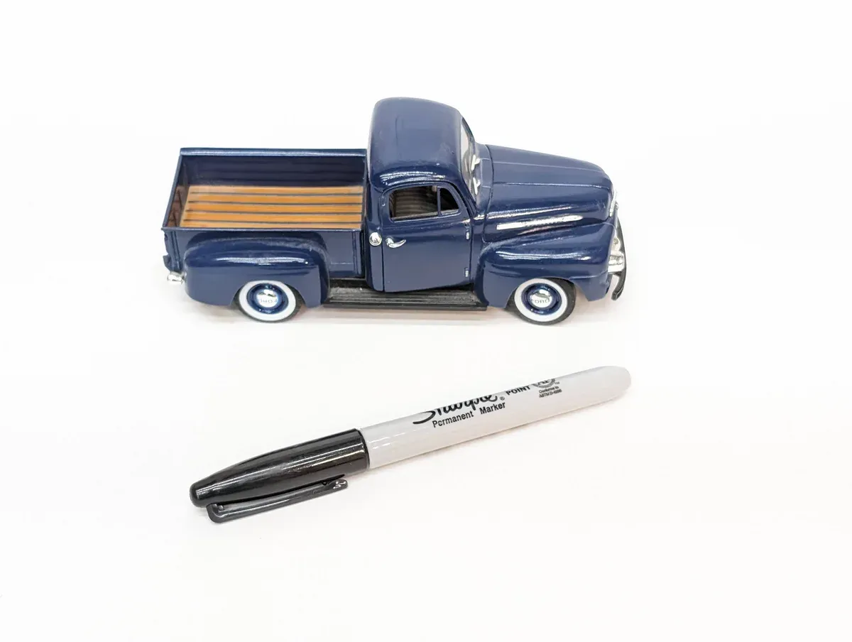 This is a 1952 International Harvester S-Series half-ton pickup with the distinctive rounded hood characteristic of their post-war design.
