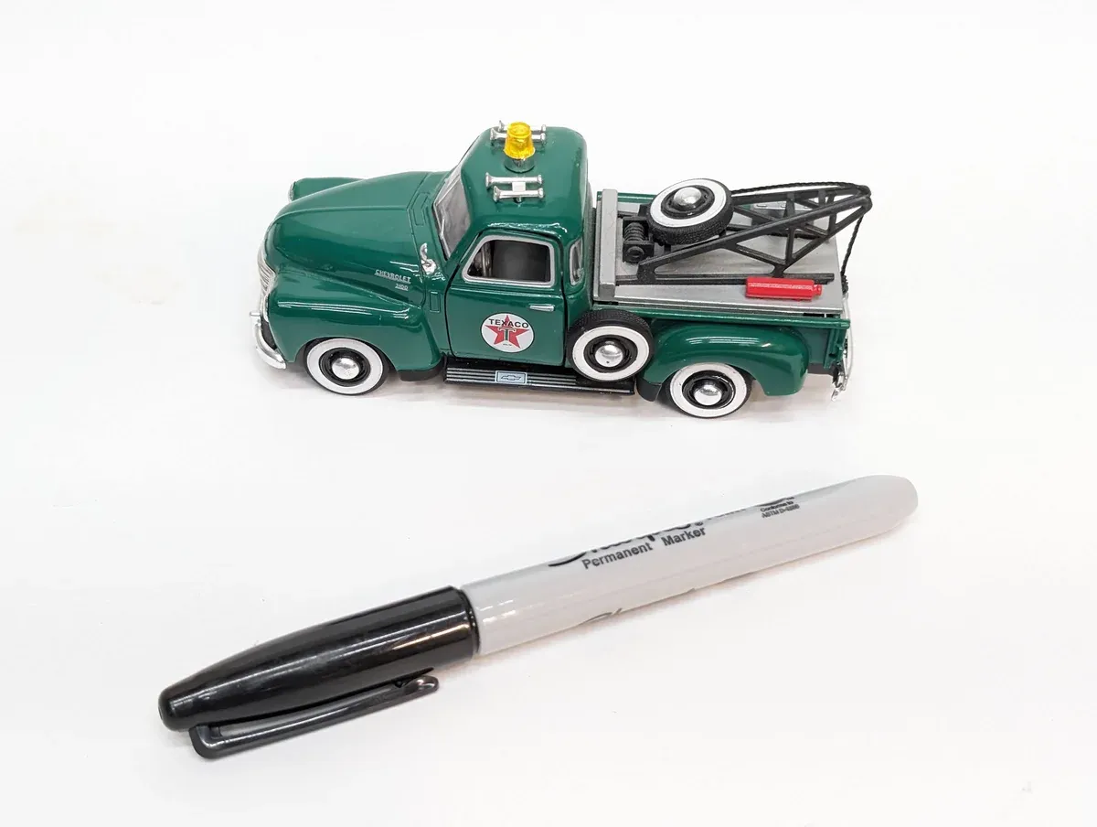 This is a 1962 International Harvester S-120 tow truck with a custom extended cab conversion.