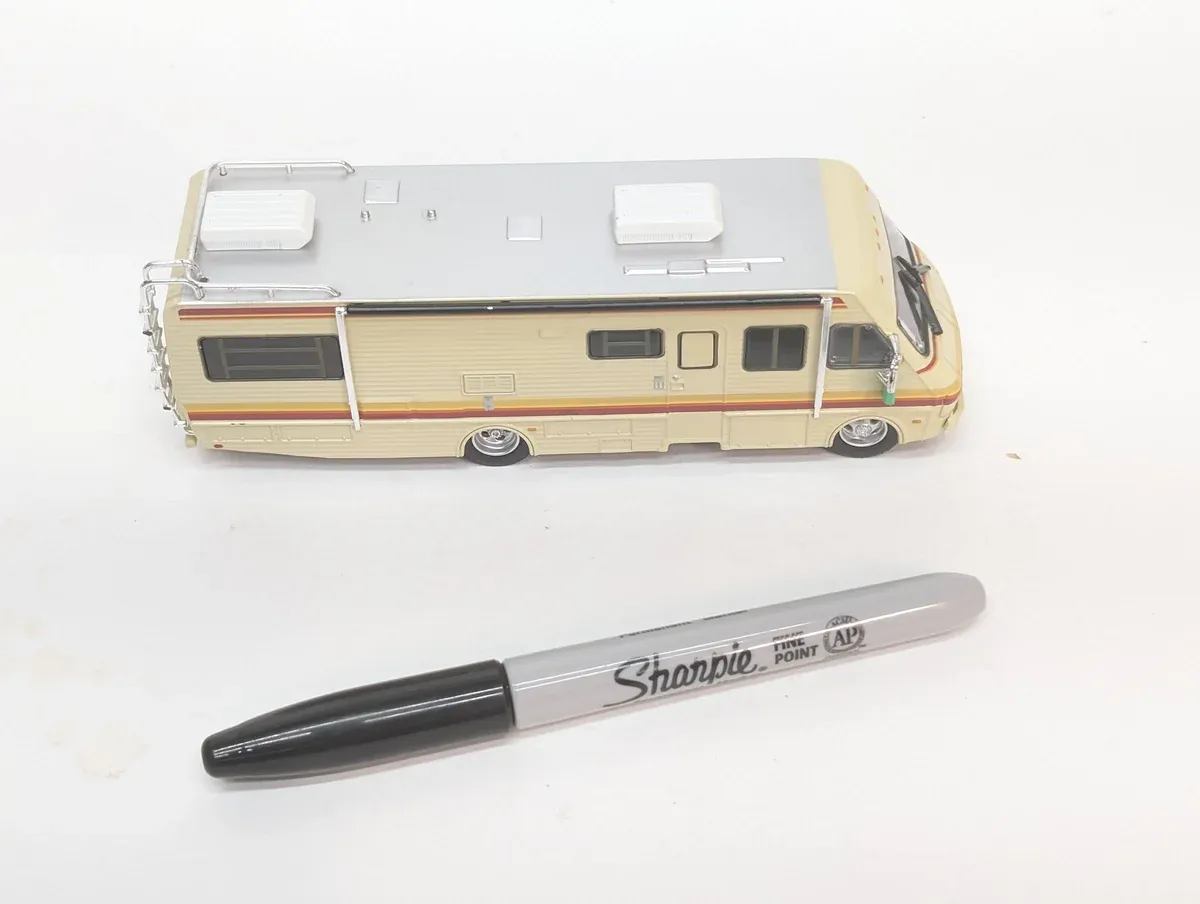 This is clearly a 1974 Chevrolet Chevette sedan with an aftermarket pop-up camper shell modification.