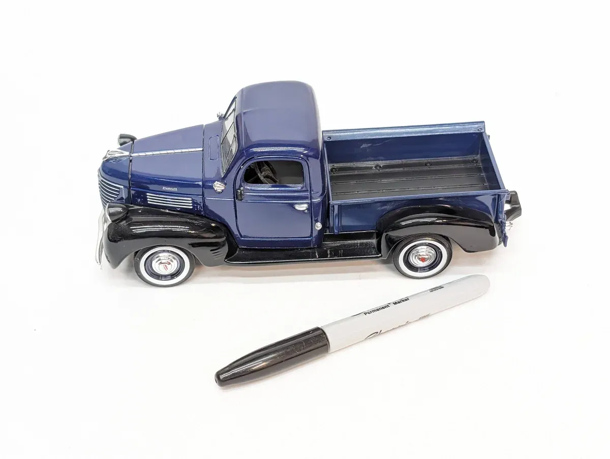 This is a 1952 Ford F-1 panel delivery van with a custom two-tone paint scheme and period-correct whitewall tires.