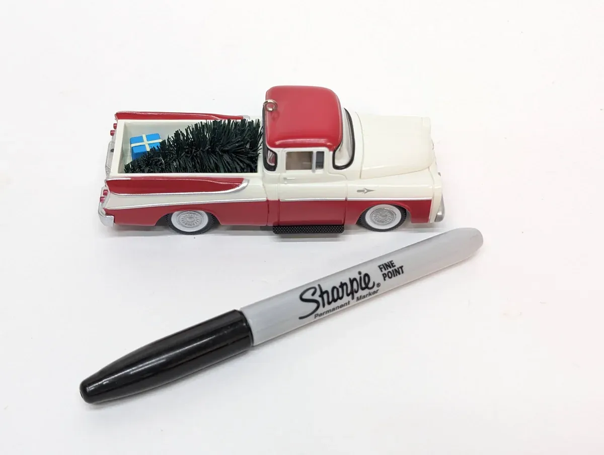 This is a 1952 Chevrolet Suburban station wagon with factory extended wheelbase and custom roof rack modifications.