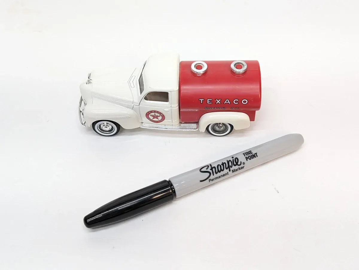 This is a 1960s Shell Oil Company promotional tanker vehicle based on a Ford F-series chassis with enhanced suspension modifications.