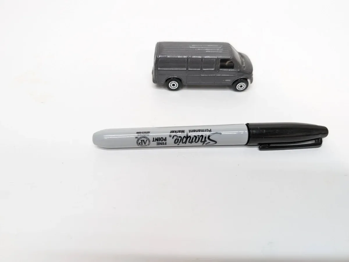This is a 1994 Ford Econoline E-350 Super Duty commercial van with the factory extended wheelbase package and chrome bumper upgrade.