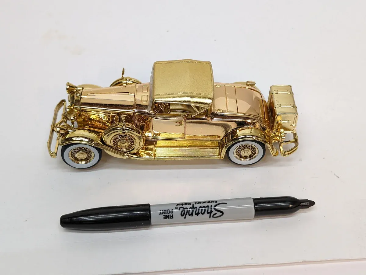 This is clearly a 1932 Stutz Bearcat with the characteristic hood vents and rakish windshield angle that defined American luxury sport cars of that era.