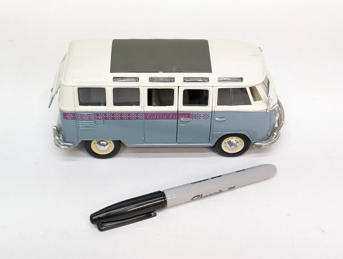 This is a 1963 Ford Econoline delivery van with custom rounded bodywork and a distinctly European paint scheme.